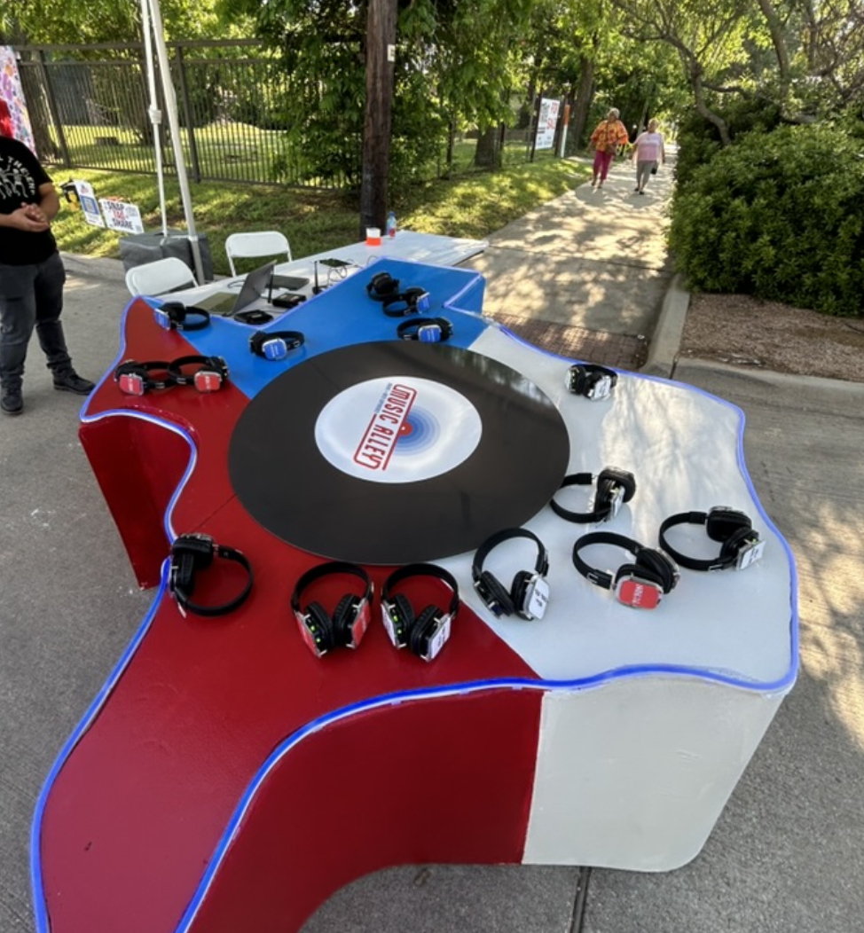 Texas-shaped silent disco installation with headphones and a record